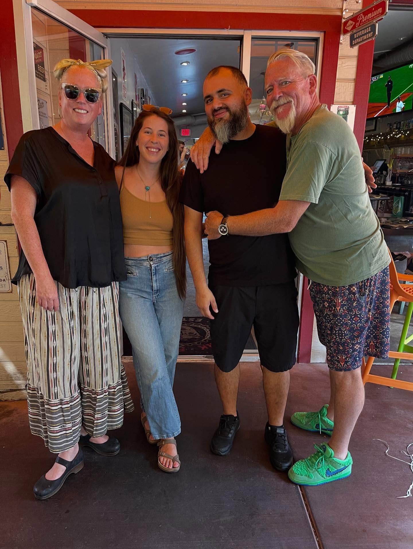 Friends raising glasses at Dad's Kitchen